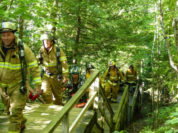 Firefighters walked the stairs to Fort Holmes (141 steps) repeatedly until they made their goal of 14 round trips . . 